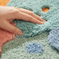 Tufted Floor Mat with Happy Text and Floral Pattern Non Slip Backing Soft Plush Decorative Scalloped Edge Indoor Rug