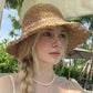 Crochet Bucket Sun Hat with Floral Embroidery and Wavy Brim Design