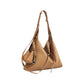 Slouchy Leather Hobo Shoulder Bag with Adjustable Strap Tassel Accent and Zip Closure