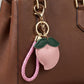 Peach Bag Charm with Braided Leather Loop and Gold Tone Hardware