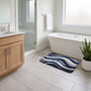 Abstract Navy Blue Wave Plush Bathroom Mat with Swirling Line Design