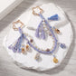 Purple Coastal Bag Charm with Star Clips Pearl Look Beads Braided Cord and Tassels