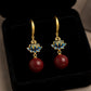 Lotus Drop Earrings with Delicate Petal Motif and Smooth Round Bead Accent for an Artistic Feminine Statement Accessory