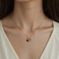 Interlocking Heart Pendant Necklace with Crystal Accents and Polished Metal Design on a Delicate Chain