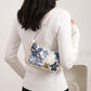 Floral Embroidered Shoulder Bag with Sequin Accents Chain Strap Detail Crescent Handbag 10x5x2.5 in