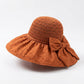 Wide Brim Crochet Sun Hat with Bow Accent and Textured Fabric Brim