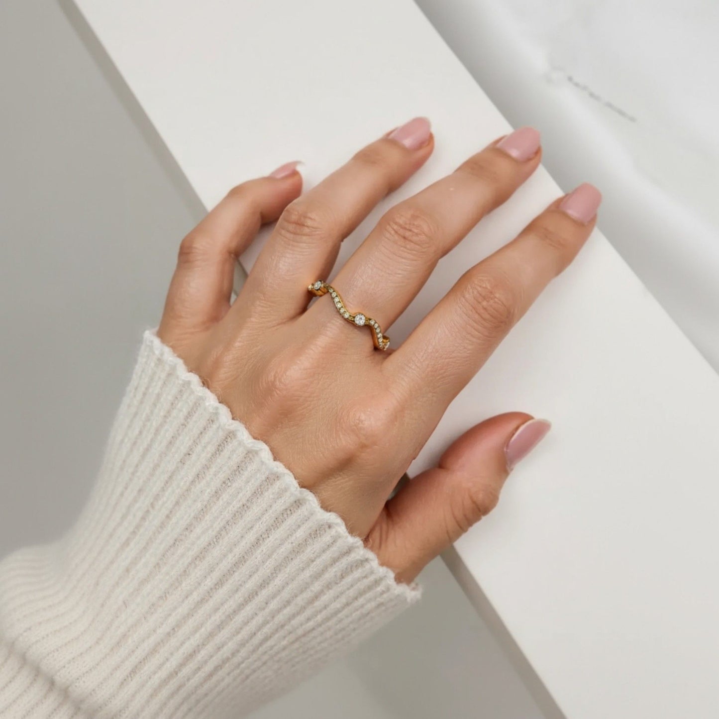 Women's Wavy Band Ring with Delicate Sparkling Accents and Sleek Polished Metal Design