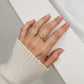 Women's Wavy Band Ring with Delicate Sparkling Accents and Sleek Polished Metal Design