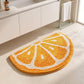 Kiwi Fruit Slice Plush Semicircle Bathroom Mat with Green Tufted Design