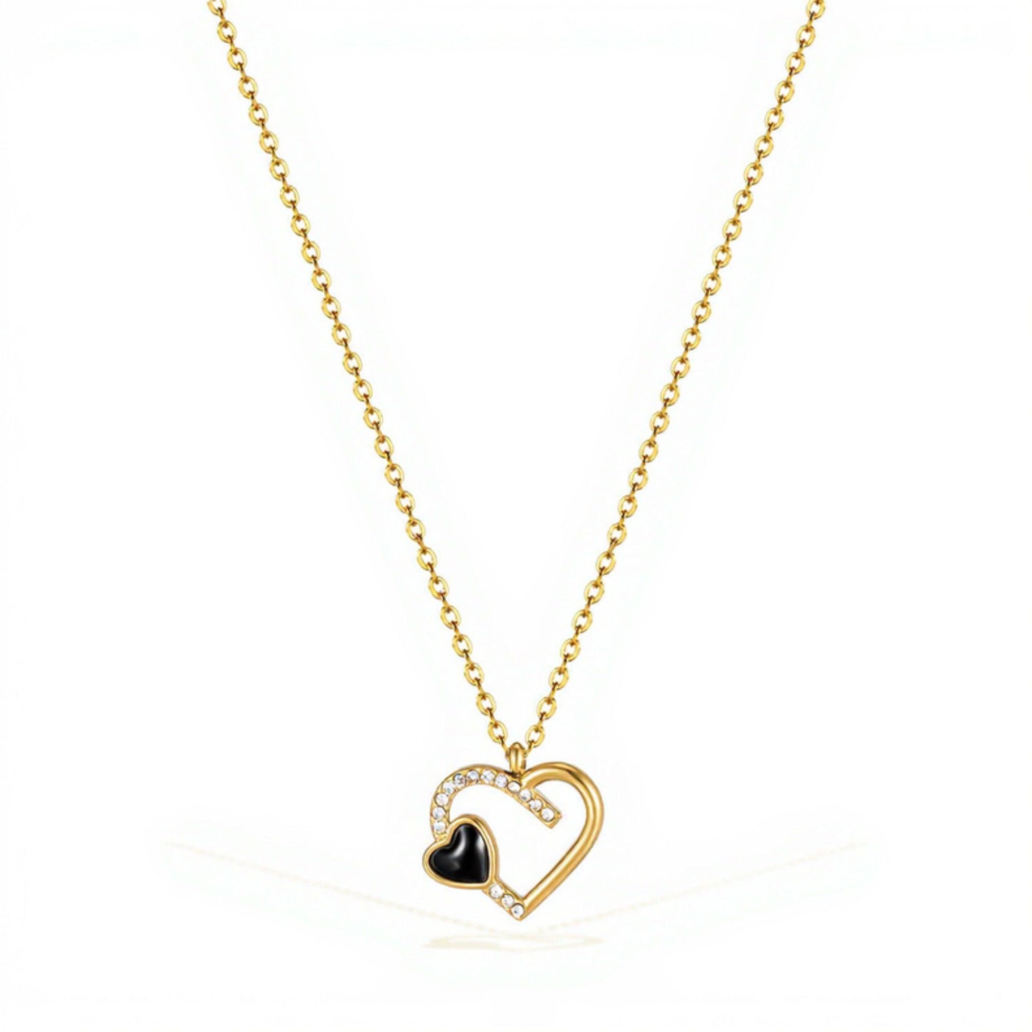 Interlocking Heart Pendant Necklace with Crystal Accents and Polished Metal Design on a Delicate Chain