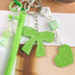 Multi-Element Bag Charm with Hanging Strap and Decorative Accents