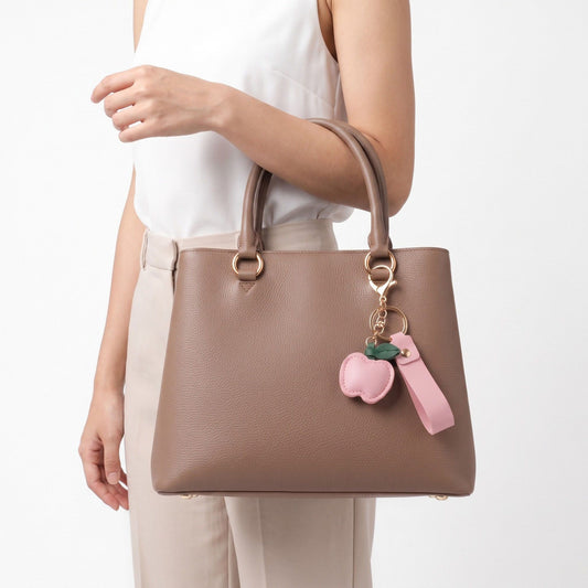 Apple Bag Charm with Faux Leather Strap and Gold Tone Hardware