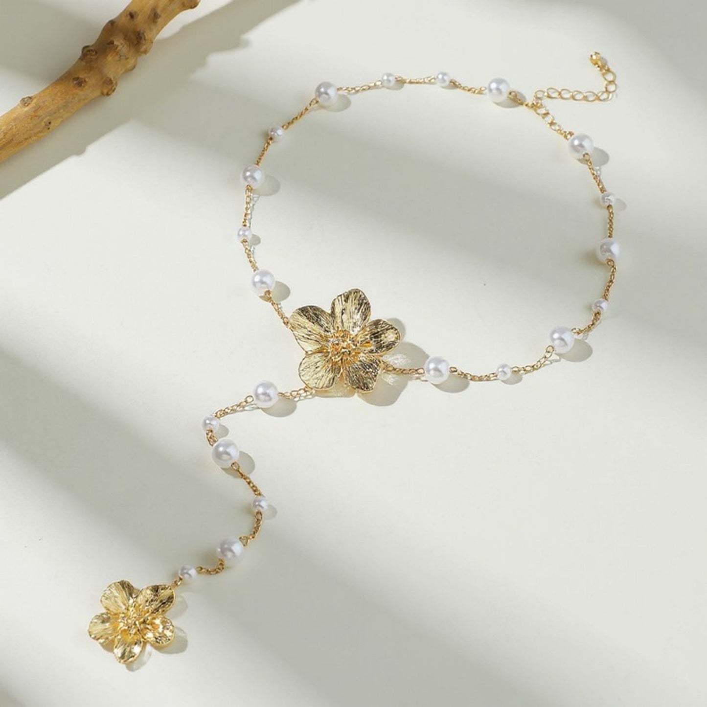 Women's Floral Pearl Drop Necklace with Dual Flower Pendant and Textured Chain Design