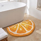 Kiwi Fruit Slice Plush Semicircle Bathroom Mat with Green Tufted Design