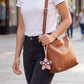 2-Piece Womens Faux Leather Bag Charm with Long Hanging Strap and Layered Detail
