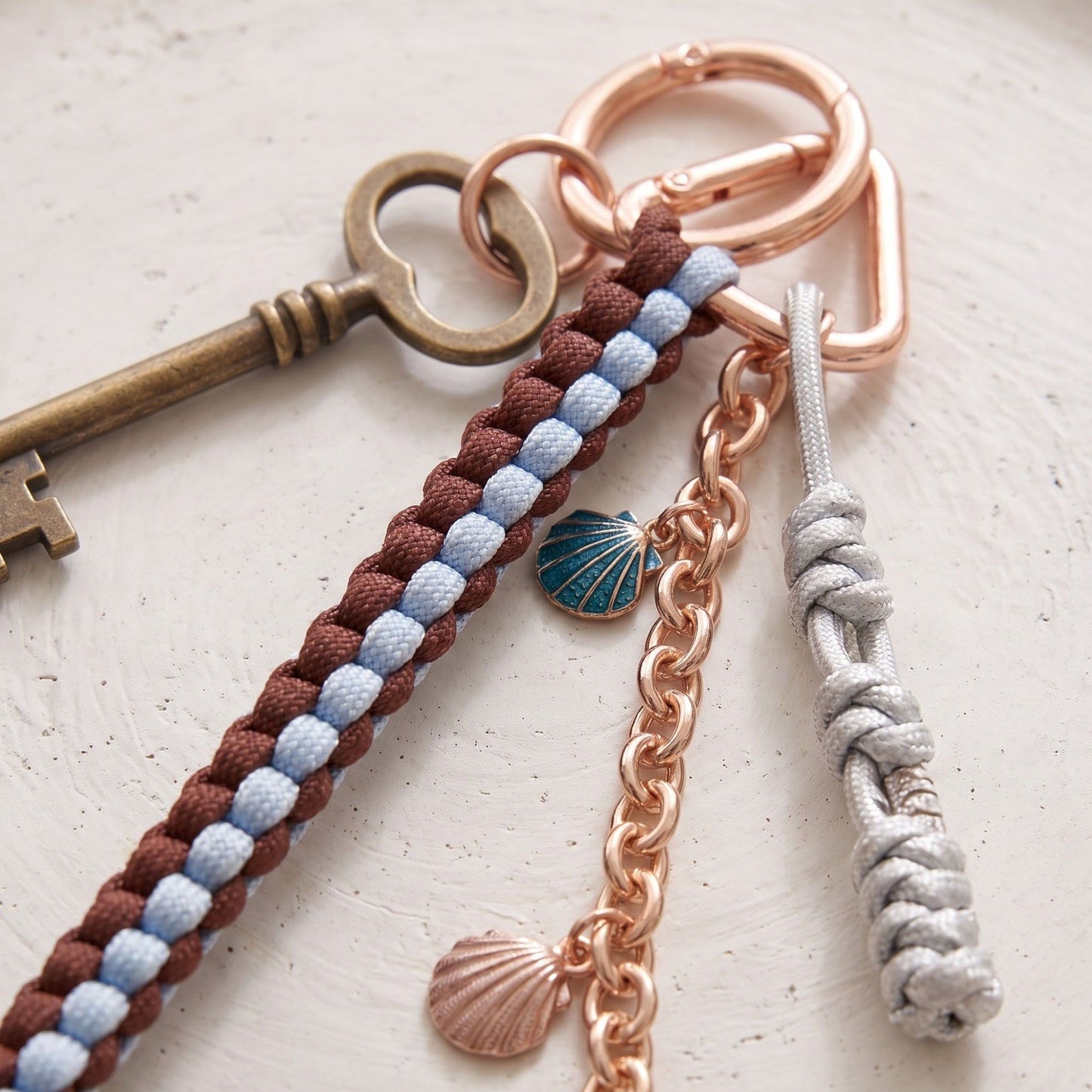Multi-Strand Braided Cord and Shell Bag Charm Keychain
