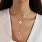 Layered Chain Necklace with Delicate Pearl Accents and Open Petal Floral Pendant Featuring Droplet Charm Detail