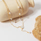 Layered Chain Necklace with Delicate Pearl Accents and Open Petal Floral Pendant Featuring Droplet Charm Detail