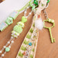 Multi-Element Bag Charm with Hanging Strap and Decorative Accents