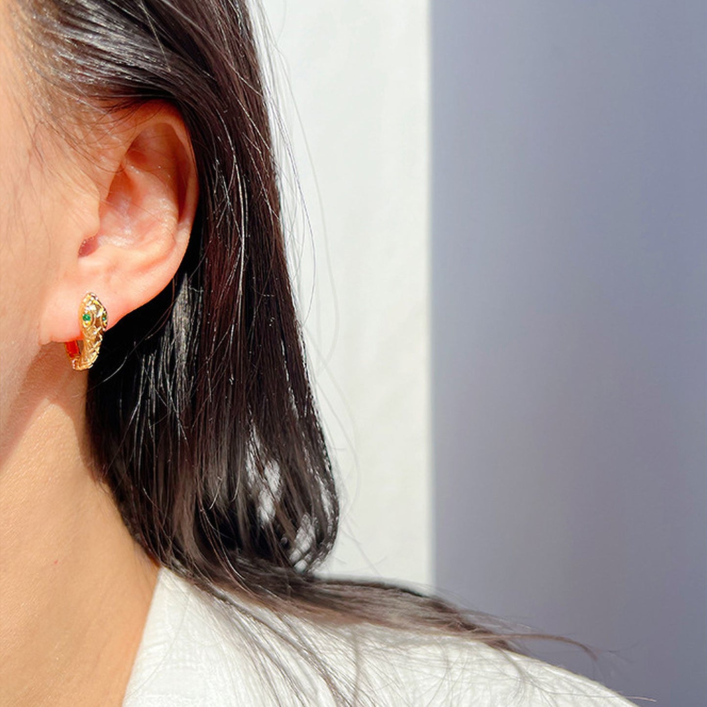 Snake-Shaped Hoop Earrings with Green Gem Eyes