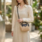Women's Mini Woven Crossbody Bag with Top Handle Adjustable Strap and Charm