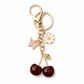 Cherry Bag Charm Keychain with Daisy and Butterfly Accents and Gold-Tone Clip