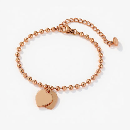 Beaded Bracelet with Dual Heart Charms Elegant Polished Metal Accents Adjustable Chain Detail for a Refined Valentine Look