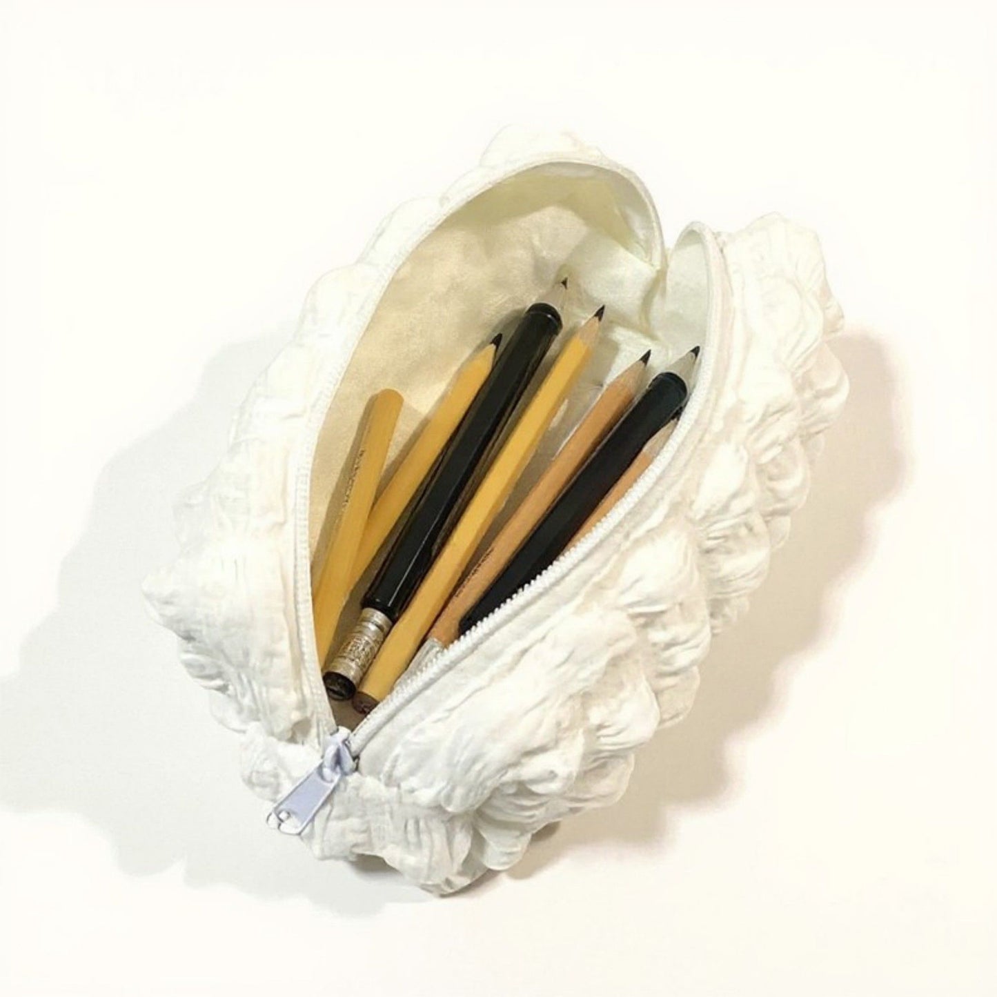 Whipped Cream-Inspired Zipper Pouch with Soft Sculpted Texture and Compact Storage Design