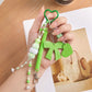 Multi-Element Bag Charm with Hanging Strap and Decorative Accents