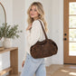 Leopard Print Barrel Shoulder Bag with Zip Closure and Interior Pockets