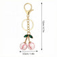 2 Pack Sports Ball Cherry Keychains with Gold Tone Clip and Leaf Charm