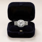Women's Cushion Halo Engagement Ring with Round Cut Center Stone and Triple Band Design