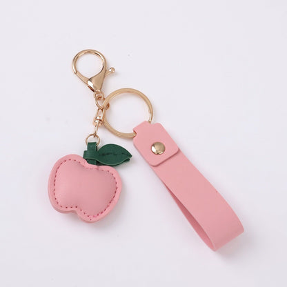 Apple Bag Charm with Faux Leather Strap and Gold Tone Hardware