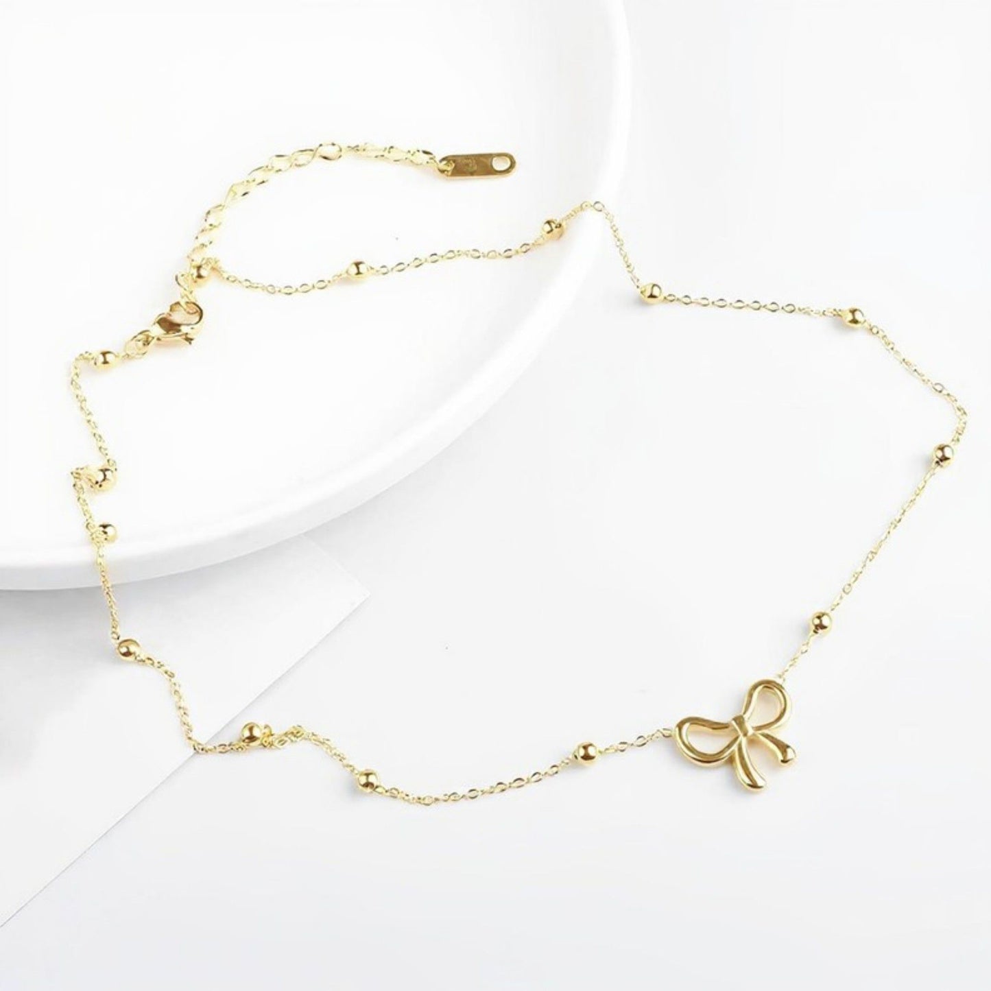 Women's Bow Pendant Necklace with Dainty Beaded Chain Design