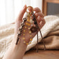 Brown Braided Rope Bag Charm with Beaded Loop and Flower Accent