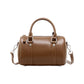 Structured Leather Barrel Satchel with Top Handles Compact Cylinder Shape and Crossbody Option