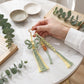 Green Macrame Flower Bag Charm with Beads Tassels Braided Cord and Star Clip