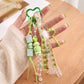Multi-Element Bag Charm with Hanging Strap and Decorative Accents