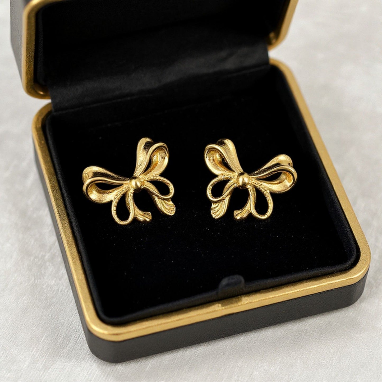 Bow Knot Stud Earrings with Open Loop Ribbon Design and Delicate Sculpted Details for a Feminine Elegant Look