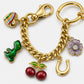Gold Tone Charm Chain Bag Accessory with Cherry Dinosaur Heart Flower and Horseshoe Accents