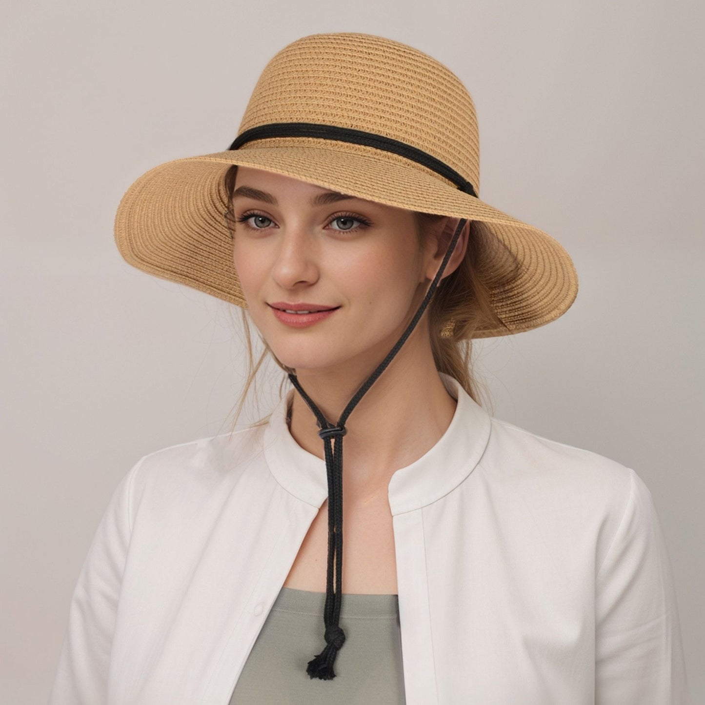 Wide Brim Straw Sun Hat with Chin Strap and Black Cord Detail for Outdoor Protection and Stylish Shade