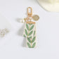 Pearl Beaded Keychain with Fabric Bow and Leaf Pattern Ribbon Charm