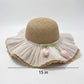 Wide Brim Straw Sun Hat with Pleated Sheer Brim Bow Accent and Floral Trim