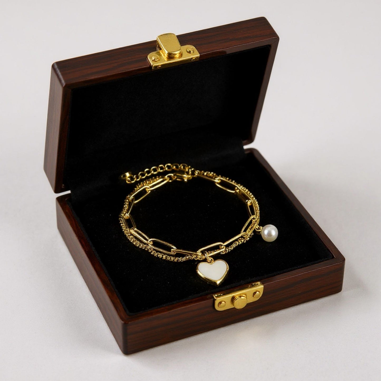 Double Layer Chain Bracelet with Heart Charm Pendant and Smooth Bead Drop Detail for a Delicate Feminine Layered Look