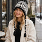 Patterned Knit Beanie with Braided Tassels