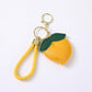 Peach Bag Charm with Braided Leather Loop and Gold Tone Hardware