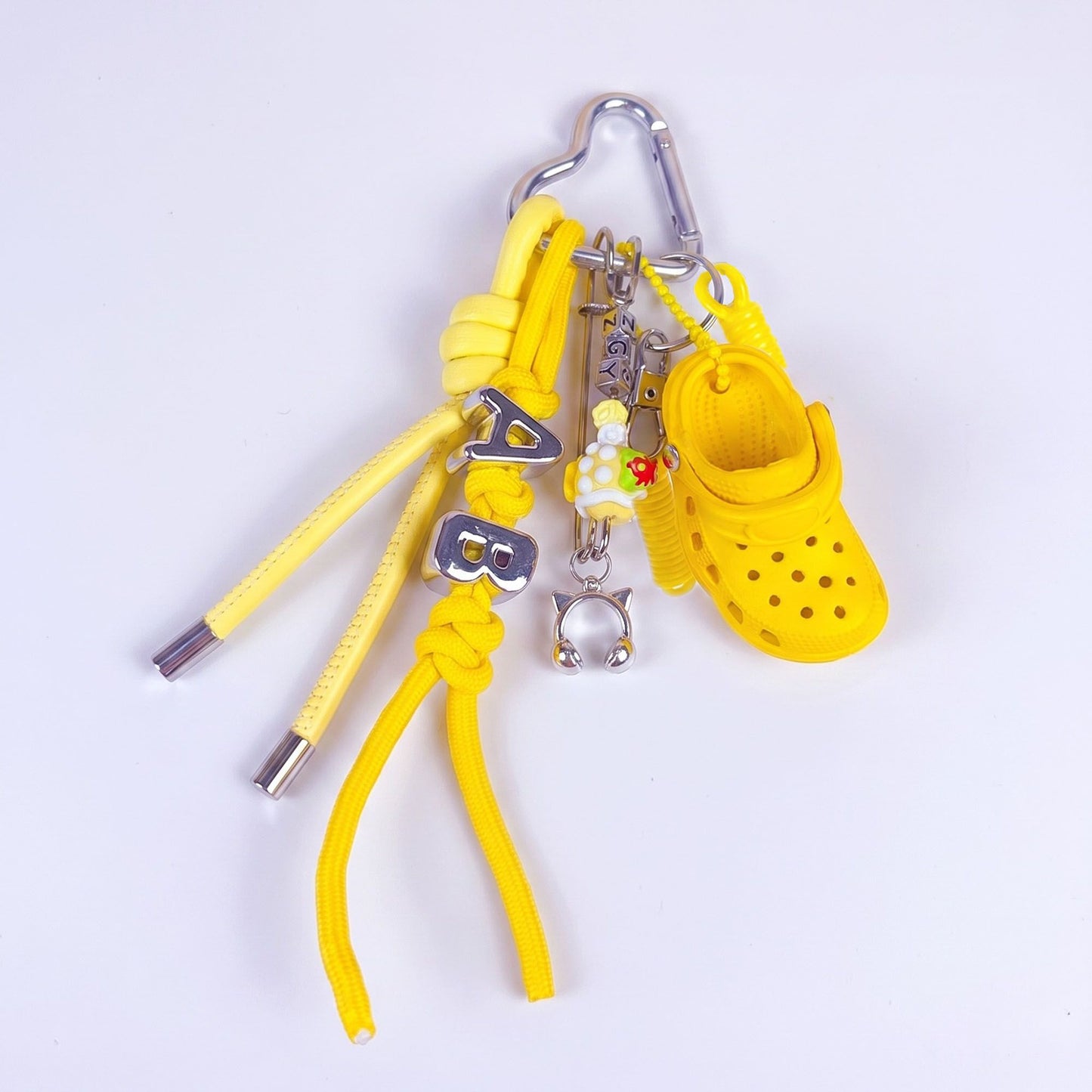 Multi-Charm Accessory with Hanging Clip and Letter Accents