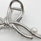 Bow Shaped Hair Clip with Faux Pearl Accent and Open Frame Design 4.5x1in