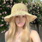 Crochet Bucket Sun Hat with Floral Embroidery and Wavy Brim Design