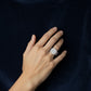 Women's Cushion Halo Engagement Ring with Round Cut Center Stone and Triple Band Design